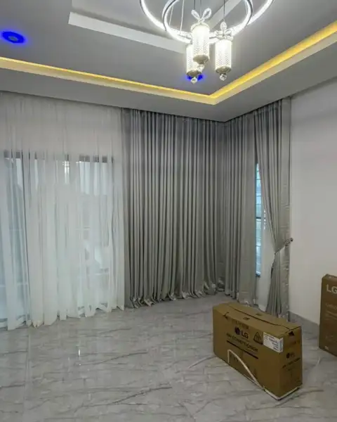 Grey wave curtains and white sheers in a new apartment