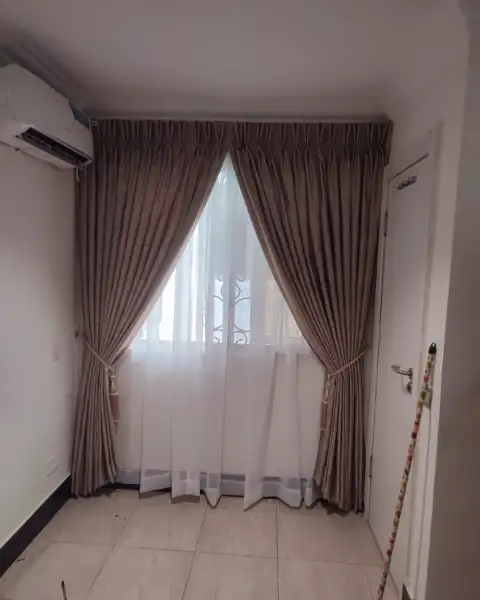 Mocha velvet curtains with tassel tie-backs